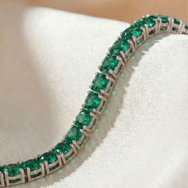 Pulseira ródio branco de rivieira 4 pontas na cor verde esmeralda