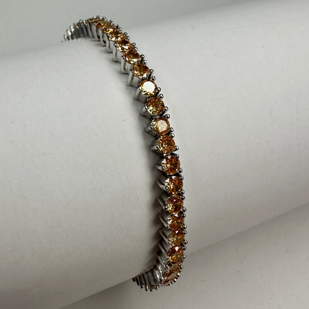 Pulseira ródio branco de rivieira 3 pontas na cor laranja claro